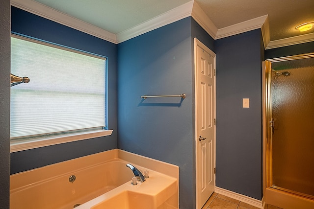 full bath featuring a stall shower, tile patterned flooring, a garden tub, and a wealth of natural light