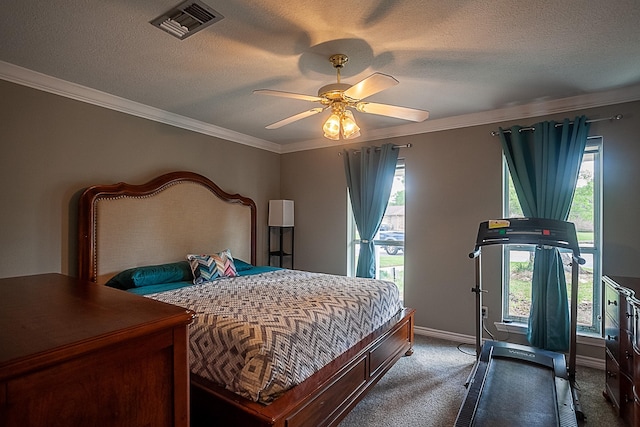 bedroom featuring carpet, visible vents, a textured ceiling, and ornamental molding