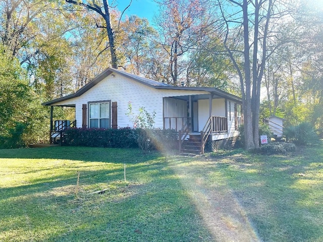 view of front of home with a porch and a front lawn