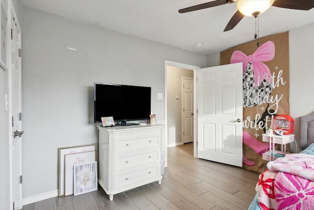 bedroom featuring hardwood / wood-style floors and ceiling fan