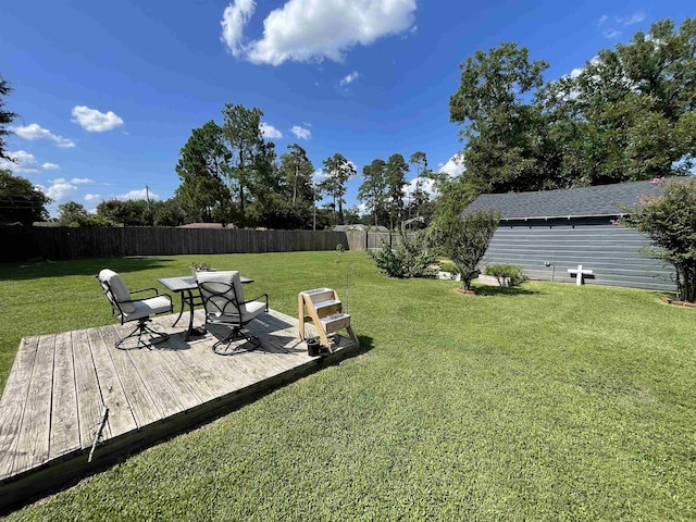 view of yard featuring a wooden deck