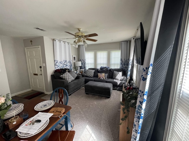 living room with carpet floors and ceiling fan