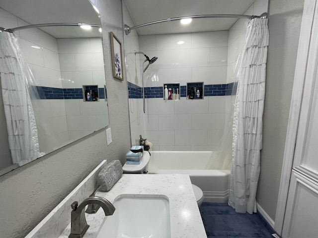 full bathroom featuring shower / bath combo, toilet, and vanity