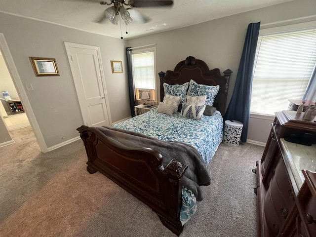 bedroom with ceiling fan and carpet