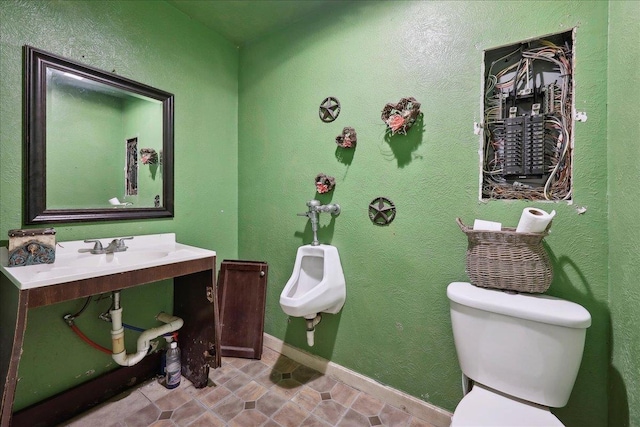 7645 Old Big Hill Rd, Beaumont, TX 77705 - half bath featuring toilet, tile patterned flooring, and a sink