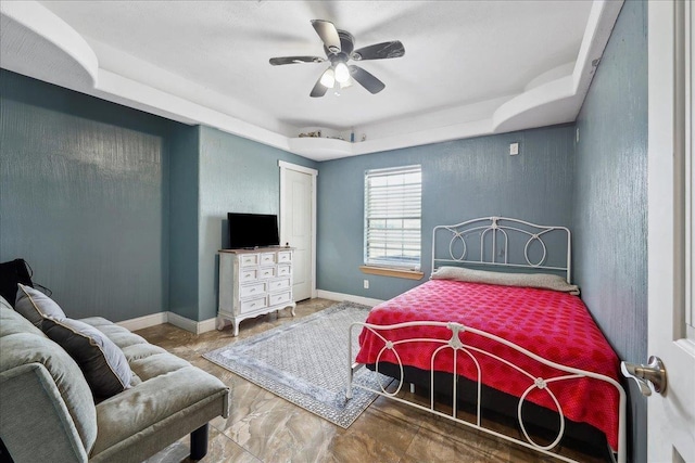 7645 Old Big Hill Rd, Beaumont, TX 77705 - bedroom with a tray ceiling, baseboards, and a ceiling fan