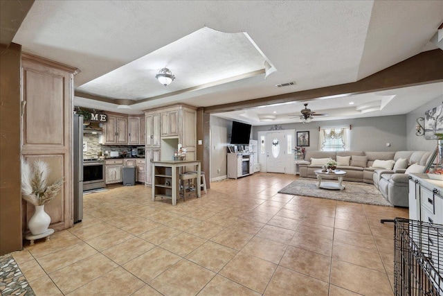 7645 Old Big Hill Rd, Beaumont, TX 77705 - kitchen featuring a raised ceiling, open floor plan, electric range, and a ceiling fan
