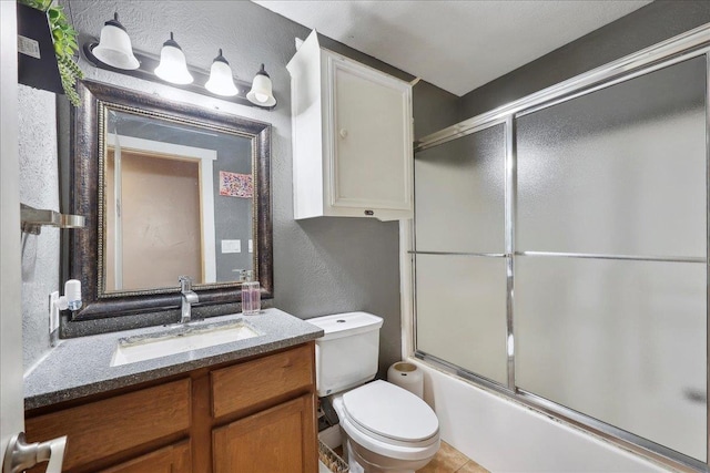7645 Old Big Hill Rd, Beaumont, TX 77705 - full bath with a textured wall, vanity, bath / shower combo with glass door, and toilet