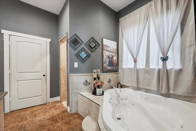 7645 Old Big Hill Rd, Beaumont, TX 77705 - full bathroom with a tub with jets