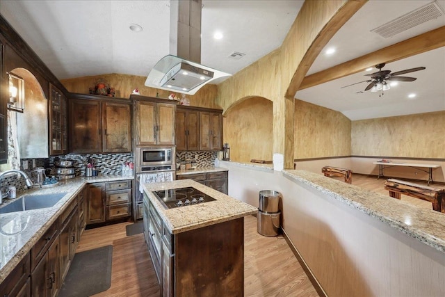 7645 Old Big Hill Rd, Beaumont, TX 77705 - kitchen with a sink, stainless steel appliances, light stone countertops, decorative backsplash, and a ceiling fan