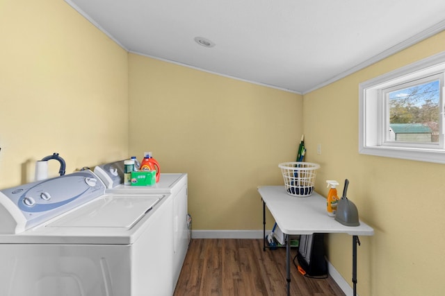 clothes washing area with baseboards, dark wood finished floors, ornamental molding, laundry area, and independent washer and dryer