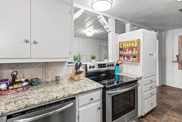 kitchen featuring stainless steel appliances, light stone countertops, decorative backsplash, and white cabinetry