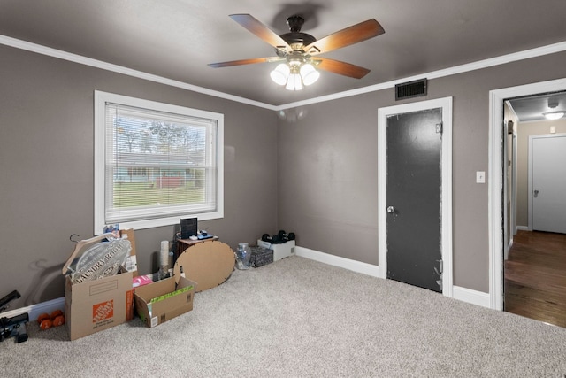 misc room with crown molding, baseboards, visible vents, and carpet floors