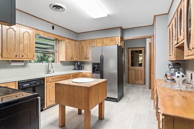 216 W Circuit Dr, Beaumont, TX 77706 - kitchen with stainless steel refrigerator with ice dispenser, tasteful backsplash, black dishwasher, crown molding, and stove