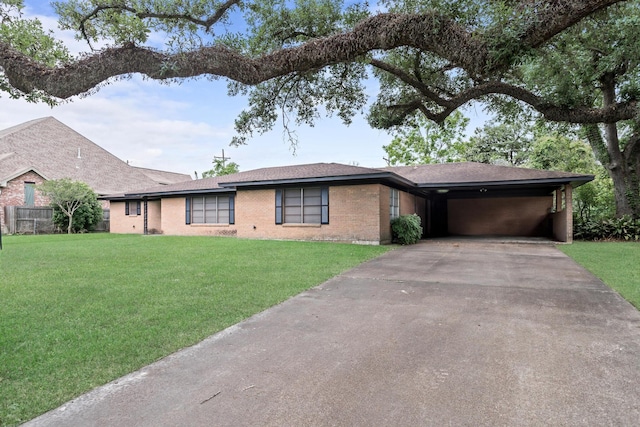 216 W Circuit Dr, Beaumont, TX 77706 - view of front of property with asphalt driveway, a carport, and brick siding