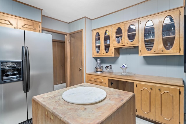 216 W Circuit Dr, Beaumont, TX 77706 - kitchen featuring stainless steel fridge, light countertops, crown molding, and glass insert cabinets