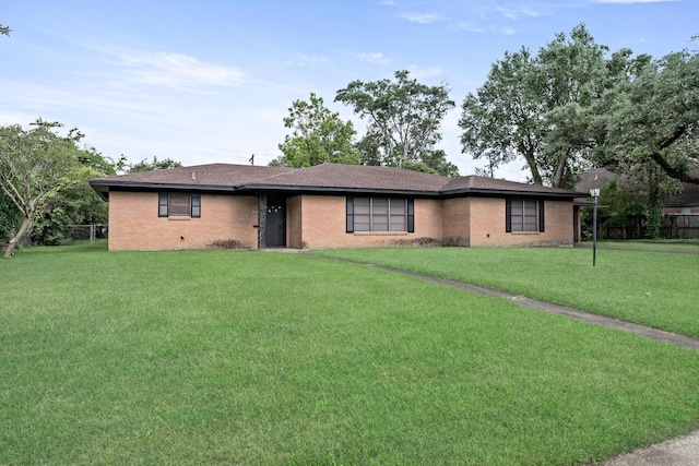 216 W Circuit Dr, Beaumont, TX 77706 - single story home with brick siding and roof with shingles