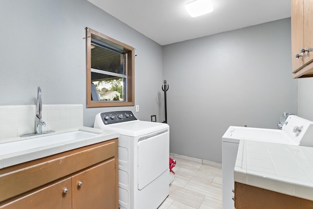 216 W Circuit Dr, Beaumont, TX 77706 - washroom featuring cabinet space and separate washer and dryer