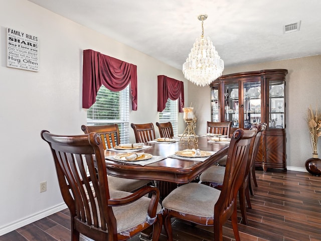 dining space featuring a chandelier