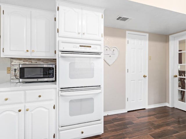 kitchen featuring white cabinets and double oven