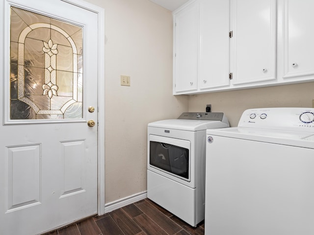 washroom with cabinets and washer and clothes dryer