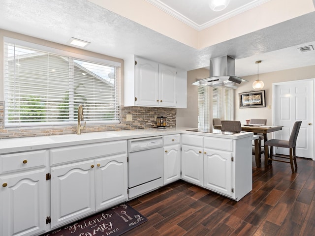 kitchen with white cabinets, pendant lighting, island range hood, and dishwasher