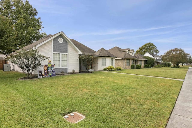 ranch-style home with a front lawn