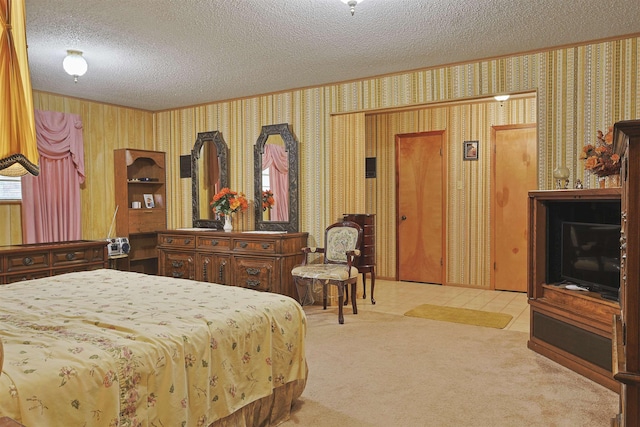4425 Cartwright St, Beaumont, TX 77707 - bedroom with a textured ceiling, wallpapered walls, and carpet flooring