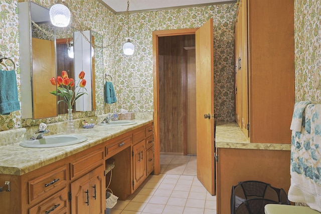 4425 Cartwright St, Beaumont, TX 77707 - bathroom with wallpapered walls, double vanity, tile patterned floors, and ornamental molding