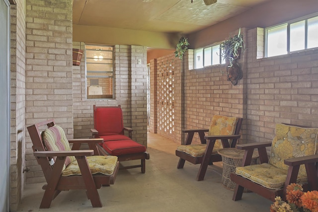 4425 Cartwright St, Beaumont, TX 77707 - living area featuring brick wall and carpet