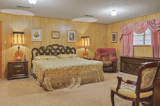 4425 Cartwright St, Beaumont, TX 77707 - bedroom with carpet floors, a textured ceiling, and wood walls