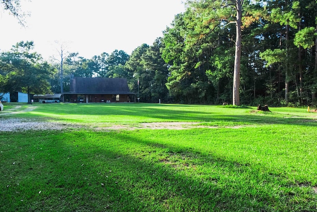 view of home's community featuring a lawn