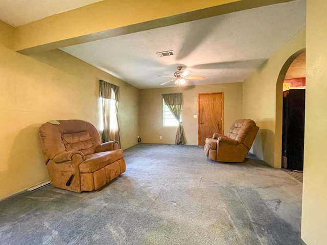 8140 Tx State Highway 62, Buna, TX 77612 - sitting room with visible vents, ceiling fan, arched walkways, and carpet floors