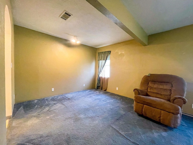 8140 Tx State Highway 62, Buna, TX 77612 - sitting room with visible vents, beamed ceiling, and carpet