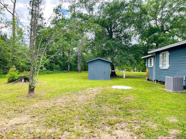 8140 Tx State Highway 62, Buna, TX 77612 - view of yard featuring an outbuilding, a shed, and central AC