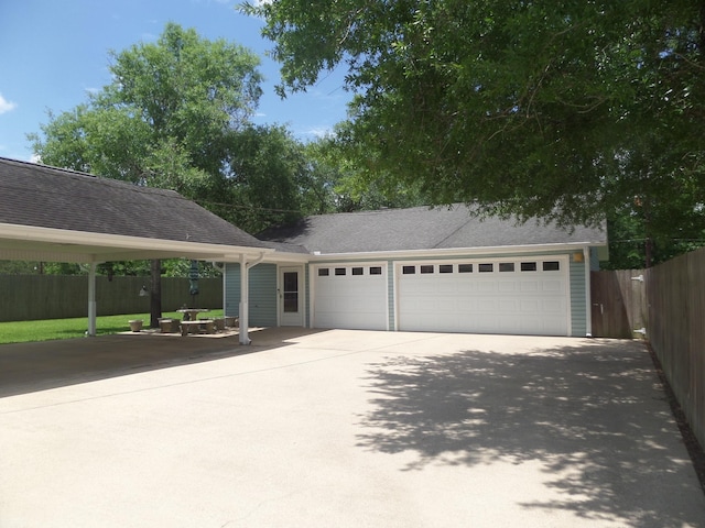 7035 Carroll Ln, Beaumont, TX 77713 - view of front of property with fence, driveway, an attached garage, and a shingled roof