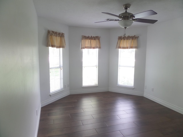 7035 Carroll Ln, Beaumont, TX 77713 - empty room with baseboards, a ceiling fan, and wood finished floors