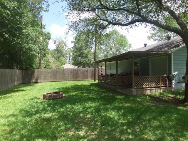 7035 Carroll Ln, Beaumont, TX 77713 - view of yard with an outdoor fire pit