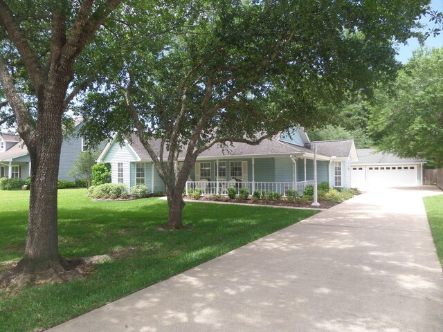 7035 Carroll Ln, Beaumont, TX 77713 - view of front of property featuring a porch, a front lawn, driveway, and a garage