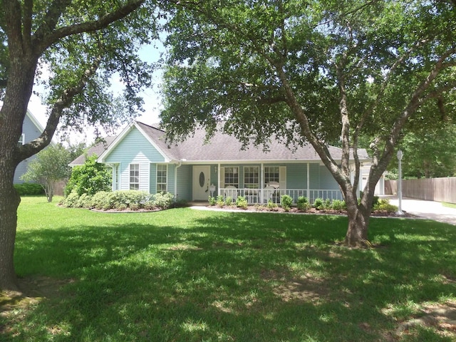 7035 Carroll Ln, Beaumont, TX 77713 - ranch-style house with a porch