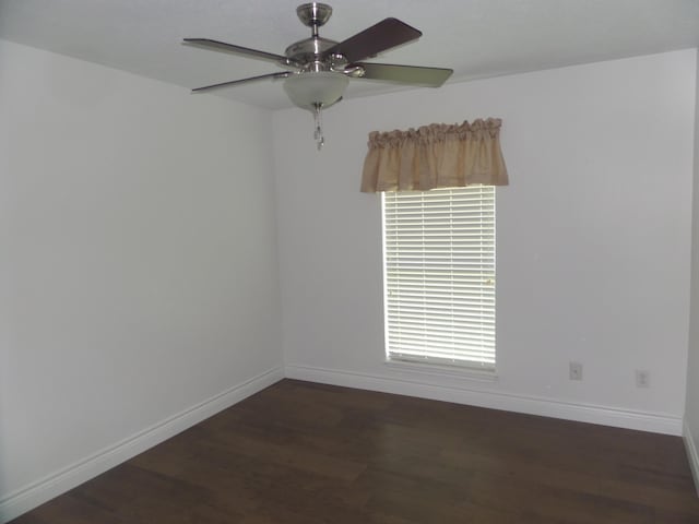 7035 Carroll Ln, Beaumont, TX 77713 - spare room featuring wood finished floors, a ceiling fan, and baseboards