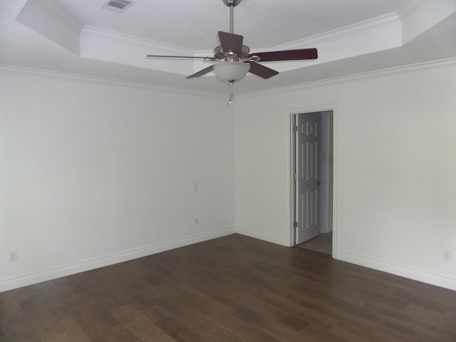 7035 Carroll Ln, Beaumont, TX 77713 - spare room with wood finished floors, a tray ceiling, a ceiling fan, ornamental molding, and baseboards
