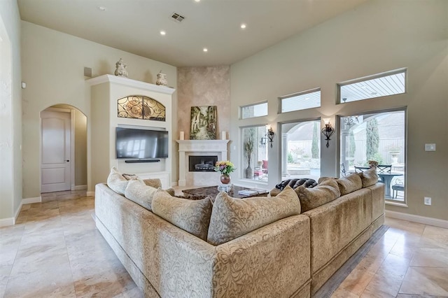 living room featuring a high ceiling