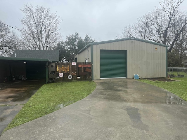 detached garage featuring driveway