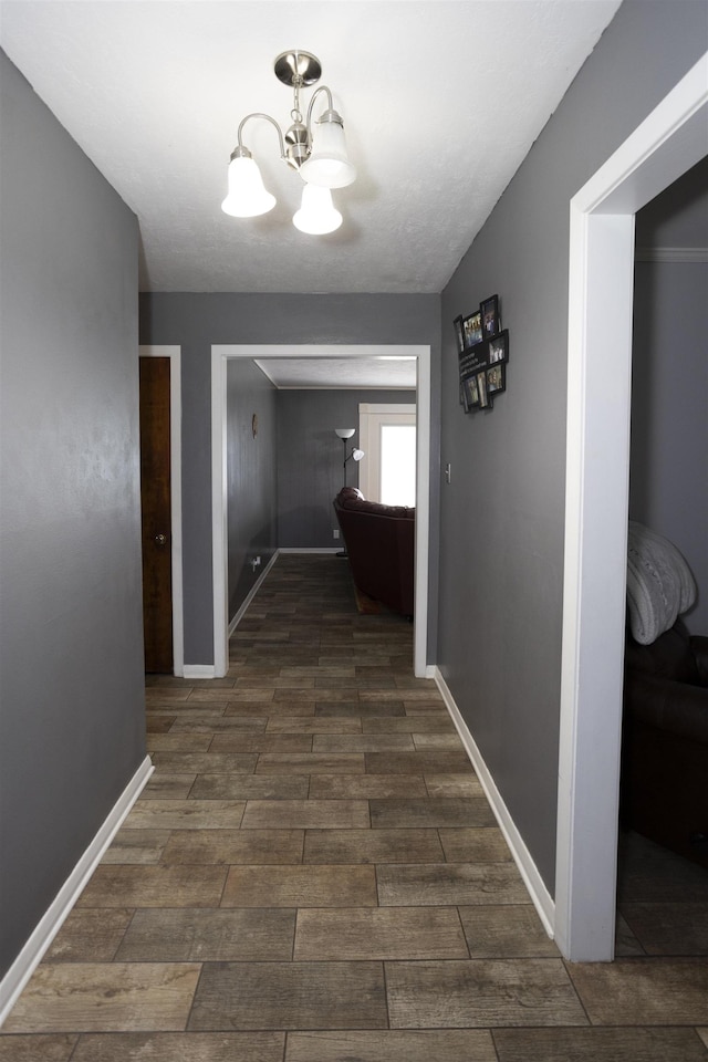 4715 Regina Ln, Beaumont, TX 77706 - hallway featuring a chandelier and dark wood-type flooring