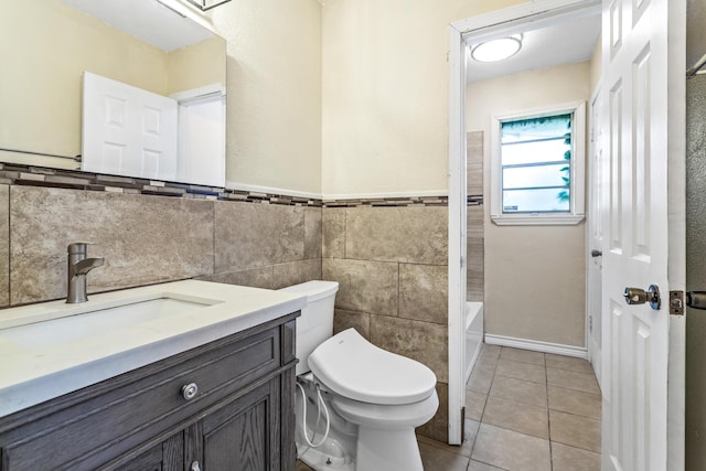 1385 Howell St, Beaumont, TX 77706 - full bathroom featuring vanity, tile walls, tile patterned floors, and a wainscoted wall
