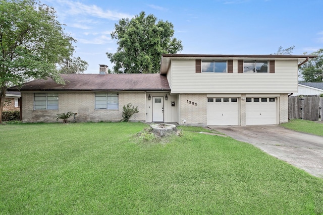 1385 Howell St, Beaumont, TX 77706 - split level home featuring brick siding, driveway, an attached garage, and a chimney