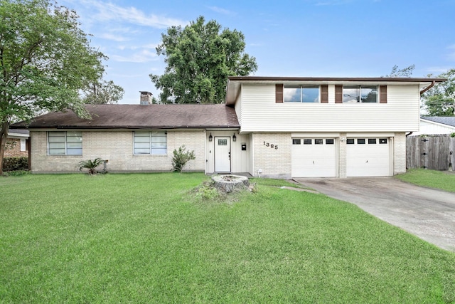 1385 Howell St, Beaumont, TX 77706 - split level home featuring brick siding, driveway, an attached garage, and a chimney
