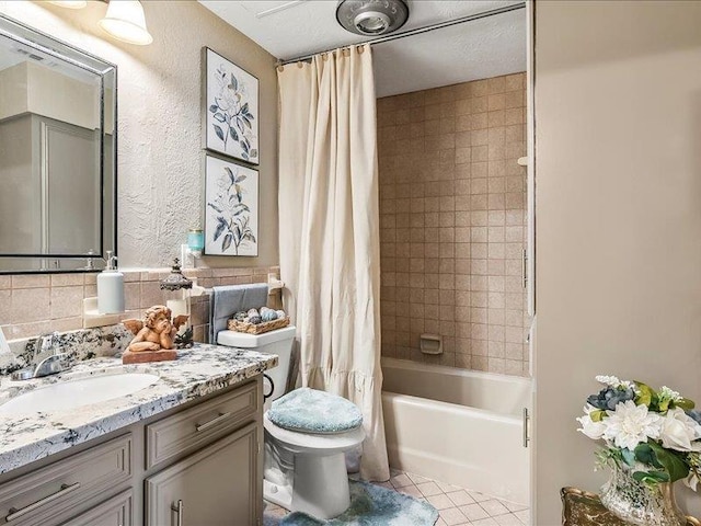 full bathroom with shower / bath combination with curtain, backsplash, vanity, tile patterned flooring, and toilet