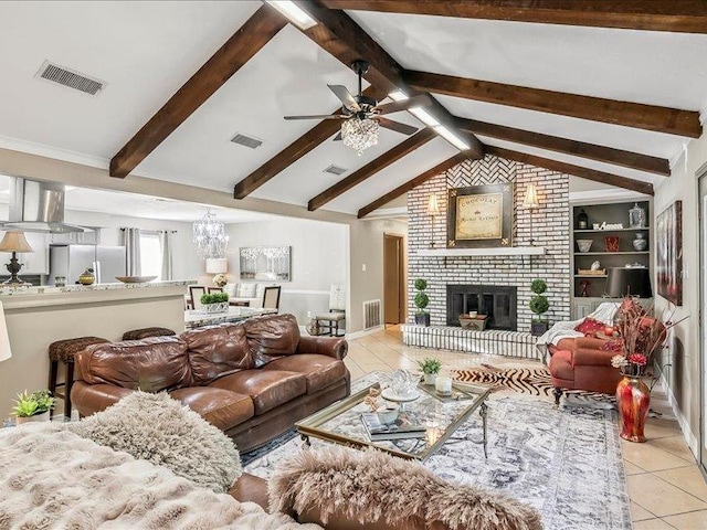 tiled living room featuring ceiling fan with notable chandelier, a brick fireplace, lofted ceiling with beams, and built in features